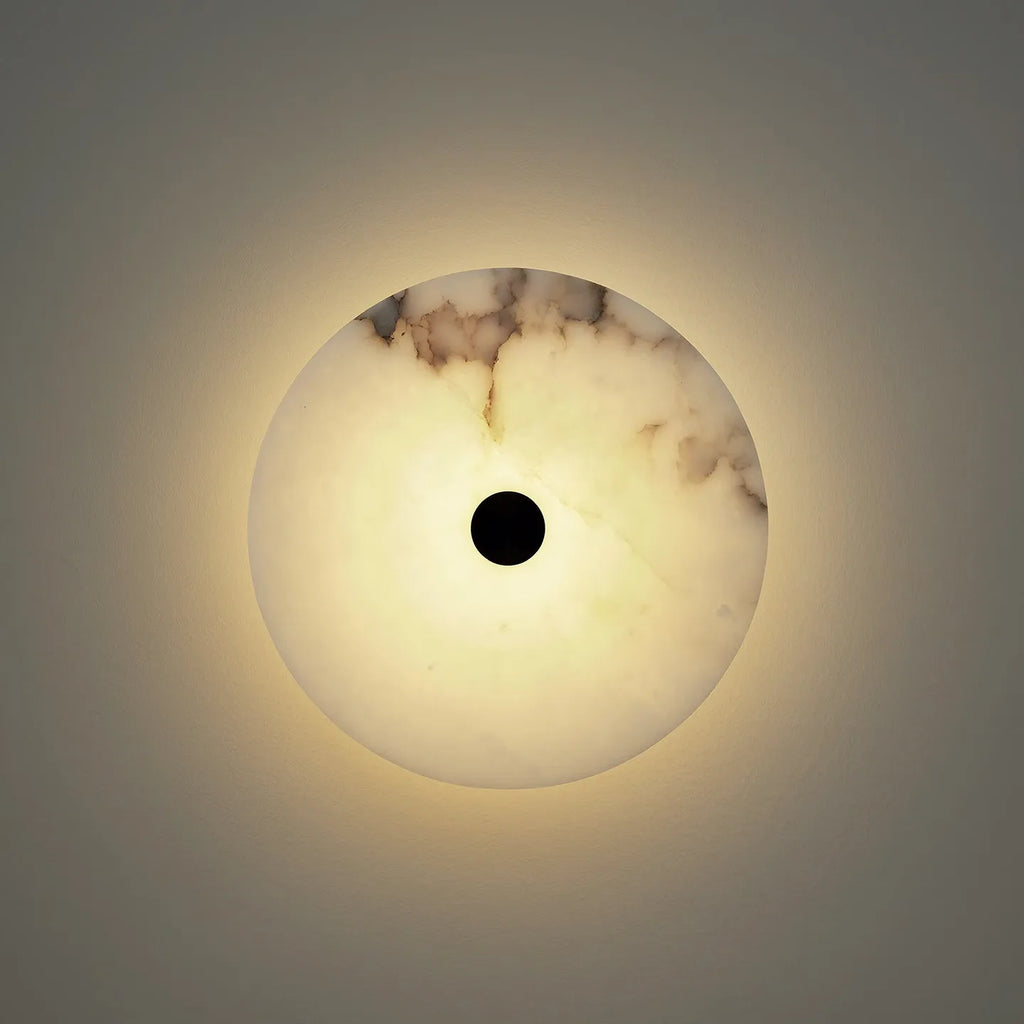 lunavera round marble wall light on iron frame