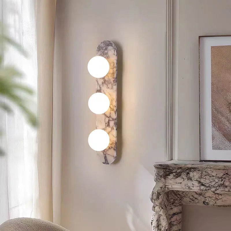 Natural marble and glass wall lamp by lunavera in warm white