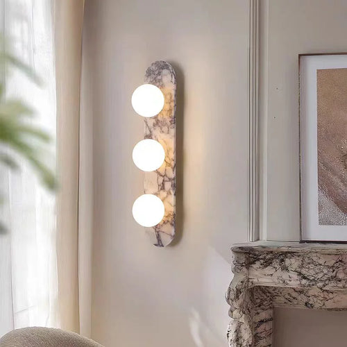 Natural marble and glass wall lamp by lunavera in warm white